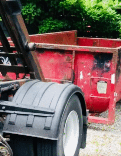 Properly loaded roll-off dumpster with debris
