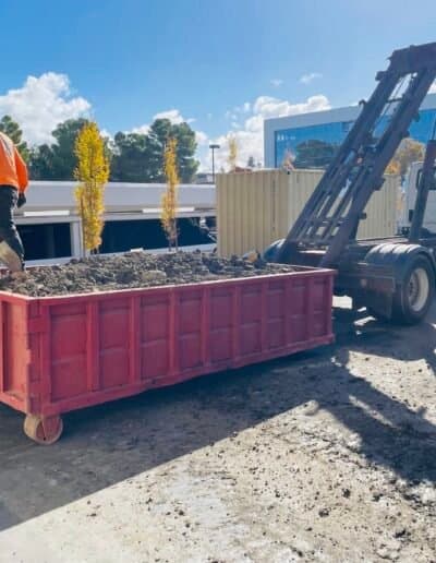 Roll-off dumpster filled with demolition materials